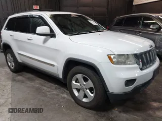 2013 Jeep Grand Cherokee Laredo with VIN 1C4RJFAG9DC532919, listed as a IAAI auction lot 40918828 with 140,093 mi miles. Bid and sale history available at carsss.com. Image 1.