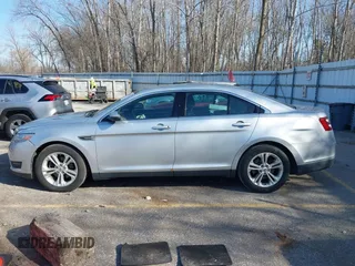 2013 Ford Taurus SEL with VIN 1FAHP2E8XDG191132, listed as a IAAI auction lot 41833542 with 165,125 mi miles. Bid and sale history available at carsss.com. Image 14.