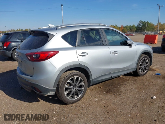 2016 Mazda CX-5 Grand Touring z VIN JM3KE2DY3G0712249, wystawiony jako IAAI lot #37910910 z przebiegiem 262 058 mil mil oraz . Historia ofert i sprzedaży dostępna na DreamBid. Obrazek 4.