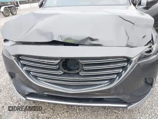 2016 Mazda CX-9 Grand Touring with VIN JM3TCBDY1G0103560, listed as a IAAI auction lot 41344813 with 123,588 mi miles and . Bid and sale history available at DreamBid. Image 6.