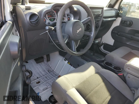 2010 Jeep Wrangler Sport with VIN 1J4AA2D16AL144842, listed as a Copart auction lot 50173535 with 106,000 mi miles and Salvage Title. Bid and sale history available at carsss.com. Image 8.