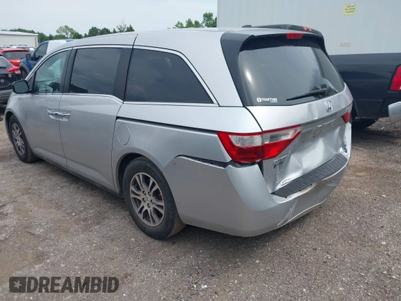 2012 Honda Odyssey EX-L with VIN 5FNRL5H66CB081323, listed as a IAAI auction lot 42465110 with 266,934 mi miles and . Bid and sale history available at DreamBid. Image 3.