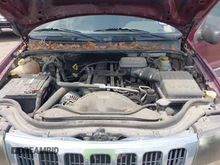 2003 Jeep Grand Cherokee Laredo with VIN 1J4GX48S83C576892, listed as a IAAI auction lot 42082865 with 212,157 mi miles. Bid and sale history available at carsss.com. Image 10.