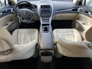 2015 Lincoln MKZ z VIN 3LN6L2JK4FR629312, wystawiony jako Copart lot #60230405 z przebiegiem 79 570 mil mil oraz Szkoda całkowita • Salvage title. Historia ofert i sprzedaży dostępna na DreamBid. Obrazek 8.