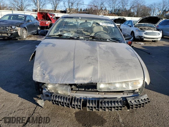1999 Saturn SL z VIN 1G8ZK5272XZ163225, wystawiony jako Copart lot #41788725 z przebiegiem 144 999 mil mil oraz Szkoda całkowita • Salvage title. Historia ofert i sprzedaży dostępna na DreamBid. Obrazek 5.