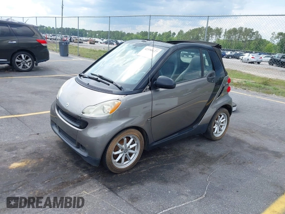 2009 Smart fortwo Passion with VIN WMEEK31XX9K299061, listed as a IAAI auction lot 42190127 with 96,156 mi miles. Bid and sale history available at carsss.com. Image 2.