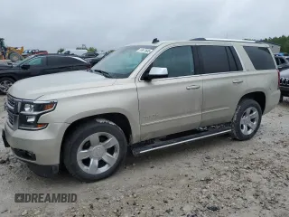 2015 Chevrolet Tahoe LTZ z VIN 1GNSKCKC5FR100084, wystawiony jako Copart lot #57677825 z przebiegiem 141 987 mil mil oraz Czysty tytuł • Clean title. Historia ofert i sprzedaży dostępna na DreamBid. Obrazek 1.