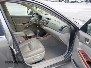 2004 Toyota Camry LE with VIN 4T1BF32K84U588764, listed as a IAAI auction lot 42126345 with 144,642 mi miles. Bid and sale history available at carsss.com. Image 5.