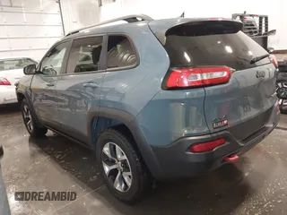 2015 Jeep Cherokee Trailhawk with VIN 1C4PJMBB4FW528633, listed as a IAAI auction lot 42147632 with 166,669 mi miles and . Bid and sale history available at DreamBid. Image 3.