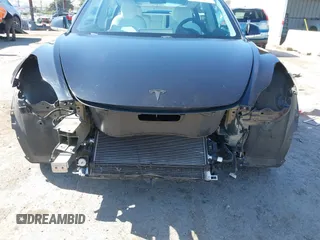 2019 Tesla Model 3 Long Range with VIN 5YJ3E1EB9KF231742, listed as a IAAI auction lot 42114608 with 86,657 mi miles and . Bid and sale history available at DreamBid. Image 6.