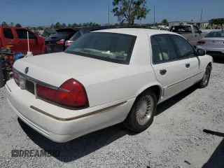 2000 Mercury Grand Marquis LS z VIN 2MEFM75W3YX689886, wystawiony jako Copart lot #54128735 z przebiegiem 54 819 mil mil oraz Szkoda całkowita • Salvage title. Historia ofert i sprzedaży dostępna na DreamBid. Obrazek 3.