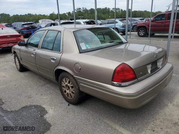 2005 Ford Crown Victoria LX with VIN 2FAFP74W95X126417, listed as a Copart auction lot 73537004 with 246,163 mi miles and Salvage Title. Bid and sale history available at carsss.com. Image 2.