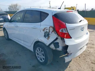 2014 Hyundai Accent GS with VIN KMHCT5AE8EU155466, listed as a IAAI auction lot 41905867 with 129,178 mi miles. Bid and sale history available at carsss.com. Image 3.