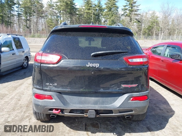 2014 Jeep Cherokee Trailhawk with VIN 1C4PJMBS3EW127749, listed as a IAAI auction lot 41836617 with 207,002 mi miles and . Bid and sale history available at DreamBid. Image 16.