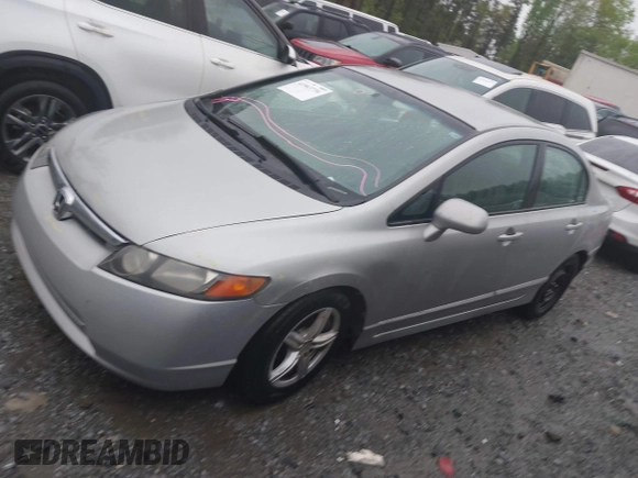 2006 Honda Civic LX with VIN 2HGFA16556H520894, listed as a IAAI auction lot 41963736 with 166,682 mi miles and . Bid and sale history available at DreamBid. Image 14.