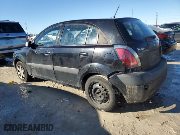 2009 Kia Rio LX with VIN KNADE243796516902, listed as a Copart auction lot 86567394 with 304,684 mi miles and Salvage Title. Bid and sale history available at carsss.com. Image 2.