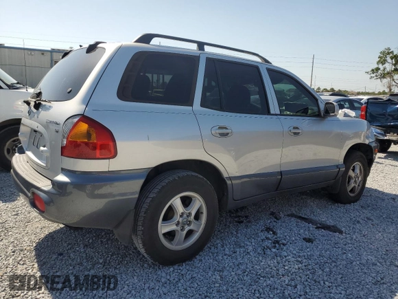 2003 Hyundai Santa Fe GLS z VIN KM8SC13D23U370587, wystawiony jako Copart lot #52775885 z przebiegiem Nie podano mil oraz Szkoda całkowita • Salvage title. Historia ofert i sprzedaży dostępna na DreamBid. Obrazek 3.