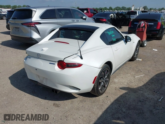 2020 Mazda MX-5 Miata Grand Touring с VIN JM1NDAM73L0414658, выставлен на аукционе IAAI как лот 42451595 с пробегом 73 339 миль миль и . История ставок и продаж доступна на DreamBid. Изображение 4.