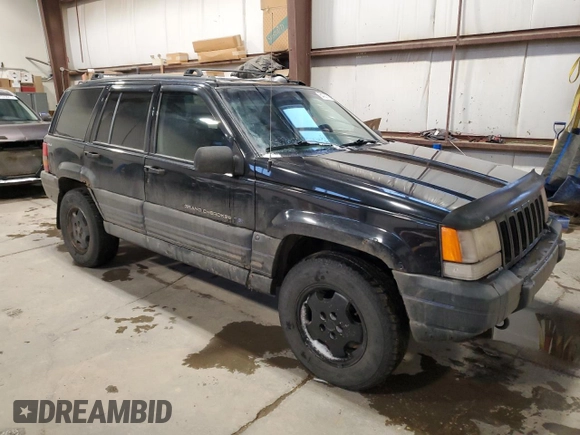 1998 Jeep Grand Cherokee Laredo with VIN 1J4GZ58Y9WC122076, listed as a Copart auction lot 84221784 with 387,353 mi miles and Salvage Title. Bid and sale history available at carsss.com. Image 4.