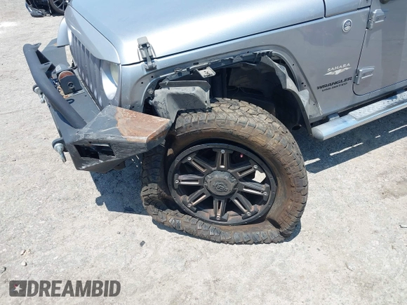 2013 Jeep Wrangler Unlimited Sahara with VIN 1C4BJWEG4DL666930, listed as a IAAI auction lot 42310569 with 206,577 mi miles and . Bid and sale history available at DreamBid. Image 6.