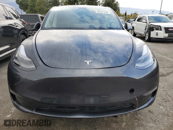 2024 Tesla Model Y with VIN 7SAYGDED1RF052031, listed as a Copart auction lot 48507865 with 5,365 mi miles and Salvage title. Bid and sale history available at DreamBid. Image 12.