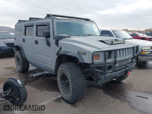 2003 Hummer H2 with VIN 5GRGN23U13H128617, listed as a IAAI auction lot 41494349 with 135,295 mi miles. Bid and sale history available at carsss.com. Image 1.