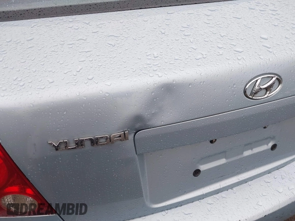 2003 Hyundai Accent GL with VIN KMHCG45C33U473080, listed as a IAAI auction lot 41868765 with 57,478 mi miles. Bid and sale history available at carsss.com. Image 6.