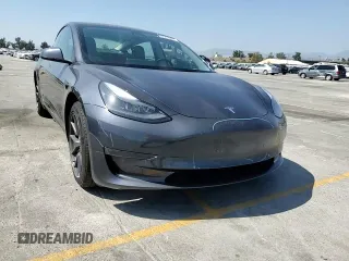 2023 Tesla Model 3 with VIN 5YJ3E1EA3PF695267, listed as a Copart auction lot 52559645 with 9,025 mi miles and Salvage title. Bid and sale history available at DreamBid. Image 14.