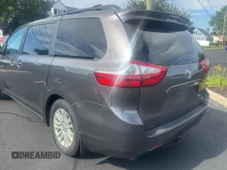 2015 Toyota Sienna XLE with VIN 5TDYK3DC5FS567460, listed as a Copart auction lot 63311295 with 296,433 mi miles and Clean title. Bid and sale history available at DreamBid. Image 3.