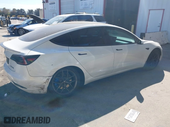 2020 Tesla Model 3 Standard Range Plus with VIN 5YJ3E1EA1LF659765, listed as a IAAI auction lot 41834411 with 42,433 mi miles and . Bid and sale history available at carsss.com. Image 4.