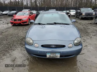 1999 Ford Taurus SE z VIN 1FAFP53U4XG150881, wystawiony jako Copart lot #40964564 z przebiegiem 124 928 mil mil oraz Tytuł czysty. Historia ofert i sprzedaży dostępna na DreamBid. Obrazek 5.