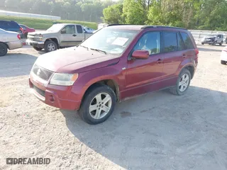 2006 Suzuki Grand Vitara Luxury with VIN JS3TD947564104838, listed as a IAAI auction lot 42082783 with 122,912 mi miles. Bid and sale history available at carsss.com. Image 2.