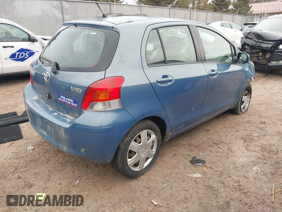 2009 Toyota Yaris with VIN JTDKT903195255240, listed as a IAAI auction lot 41650800 with 168,991 mi miles. Bid and sale history available at carsss.com. Image 4.