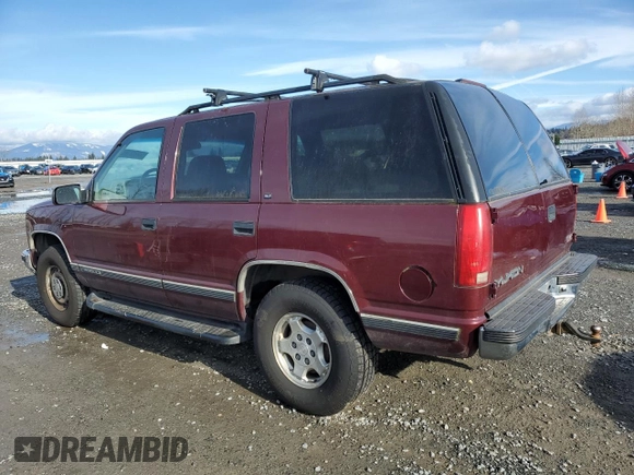 1998 GMC Yukon with VIN 1GKEK13R4WJ719517, listed as a Copart auction lot 44651715 with 230,062 mi miles and Clean Title. Bid and sale history available at carsss.com. Image 2.
