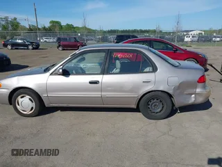 1998 Toyota Corolla VE z VIN 2T1BR18E9WC045442, wystawiony jako IAAI lot #42104201 z przebiegiem 243 256 mil mil oraz . Historia ofert i sprzedaży dostępna na DreamBid. Obrazek 14.