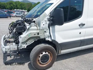 2021 Ford Transit Cargo with VIN 1FTYE1Y82MKA02296, listed as a IAAI auction lot 42377720 with 50,942 mi miles and . Bid and sale history available at DreamBid. Image 17.