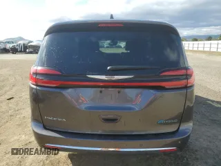 2023 Chrysler Pacifica Hybrid Touring L with VIN 2C4RC1L79PR608659, listed as a Copart auction lot 56945365 with 45,697 mi miles and Salvage title. Bid and sale history available at DreamBid. Image 6.