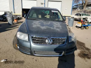 2004 Volkswagen Touareg z VIN WVGEM77L64D051760, wystawiony jako Copart lot #87044304 z przebiegiem Nie podano mil oraz Szkoda całkowita • Salvage title. Historia ofert i sprzedaży dostępna na DreamBid. Obrazek 5.