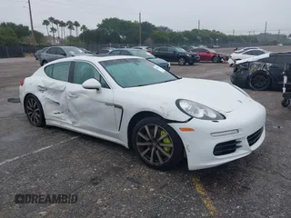 2015 Porsche Panamera S E-Hybrid z VIN WP0AD2A74FL040556, wystawiony jako IAAI lot #41406956 z przebiegiem 167 140 mil mil oraz . Historia ofert i sprzedaży dostępna na DreamBid. Obrazek 1.