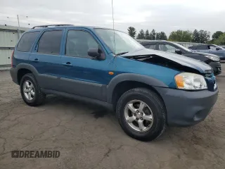 2005 Mazda Tribute i with VIN 4F2YZ02ZX5KM17738, listed as a Copart auction lot 72346384 with 203,245 mi miles and Salvage Title. Bid and sale history available at carsss.com. Image 4.