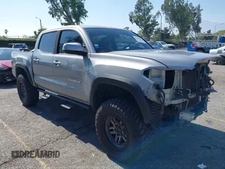 2019 Toyota Tacoma SR5 with VIN 3TMAZ5CN8KM088052, listed as a IAAI auction lot 42489340 with 97,809 mi miles and . Bid and sale history available at DreamBid. Image 1.