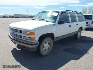 1996 Chevrolet Suburban with VIN 1GNFK16R9TJ411712, listed as a IAAI auction lot 42070739 with 242,044 mi miles. Bid and sale history available at carsss.com. Image 2.