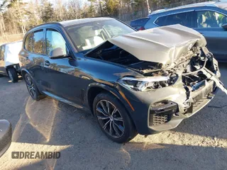 2023 BMW X5 M50i z VIN 5UXJU4C01P9P57800, wystawiony jako IAAI lot #41260899 z przebiegiem 31 881 mil mil oraz . Historia ofert i sprzedaży dostępna na DreamBid. Obrazek 1.