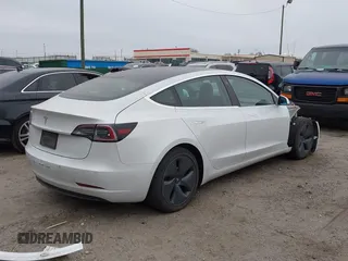 2020 Tesla Model 3 Standard Range Plus with VIN 5YJ3E1EA1LF799766, listed as a IAAI auction lot 41386508 with 90,000 mi miles. Bid and sale history available at carsss.com. Image 4.