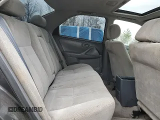 2001 Toyota Camry LE z VIN JT2BF22K010295564, wystawiony jako Copart lot #55111755 z przebiegiem 379 337 mil mil oraz Szkody całkowita. Historia ofert i sprzedaży dostępna na DreamBid. Obrazek 10.