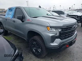 2024 Chevrolet Silverado 1500 LT Trail Boss with VIN 3GCUDFED8RG336847, listed as a IAAI auction lot 41502602 with 5,227 mi miles and . Bid and sale history available at DreamBid. Image 1.