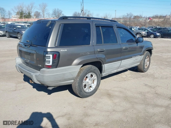 1999 Jeep Grand Cherokee Laredo with VIN 1J4GW58NXXC623753, listed as a IAAI auction lot 41685540 with 190,134 mi miles. Bid and sale history available at carsss.com. Image 4.