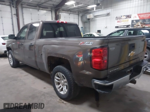 2014 Chevrolet Silverado 1500 LT with VIN 1GCVKREC9EZ240612, listed as a IAAI auction lot 41108566 with 200,625 mi miles and . Bid and sale history available at DreamBid. Image 3.