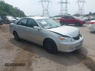 2002 Toyota Camry LE z VIN 4T1BE32K82U066376, wystawiony jako IAAI lot #42440465 z przebiegiem 165 927 mil mil oraz . Historia ofert i sprzedaży dostępna na DreamBid. Obrazek 1.