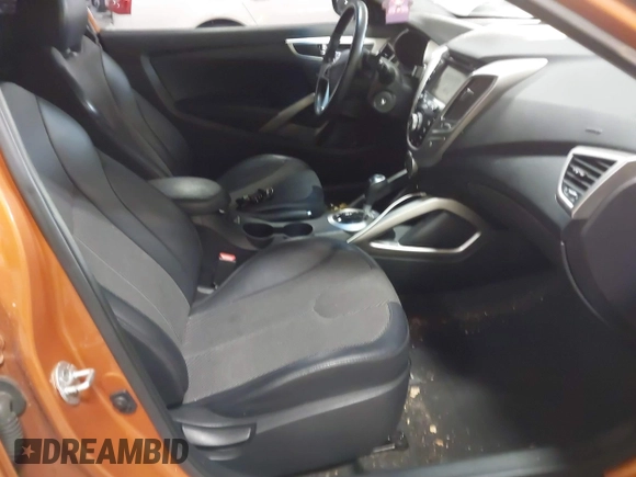 2012 Hyundai Veloster w/Gray Int z VIN KMHTC6AD6CU076954, wystawiony jako IAAI lot #41006441 z przebiegiem 73 767 mil mil oraz . Historia ofert i sprzedaży dostępna na DreamBid. Obrazek 5.
